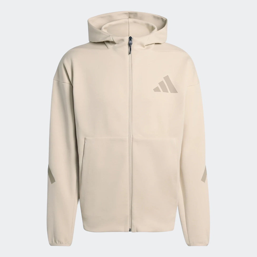 Beige Adidas Z.N.E. Full-Zip Hoodie with a hood and front zipper, showcasing the brand logo and sleeve details.