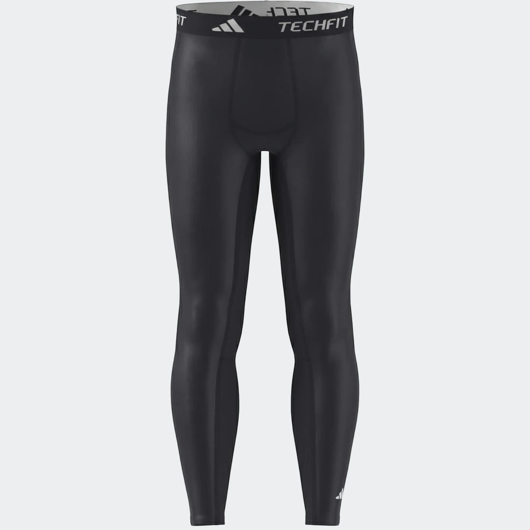 Black Adidas Techfit football base layer compression tights, shown front on a plain background.
