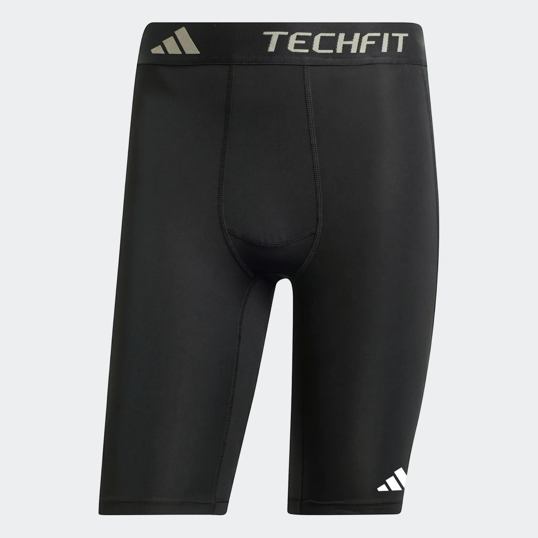 Black Adidas Techfit Football Base Layer Short Tights for men, shown laid flat on a gray background. Features