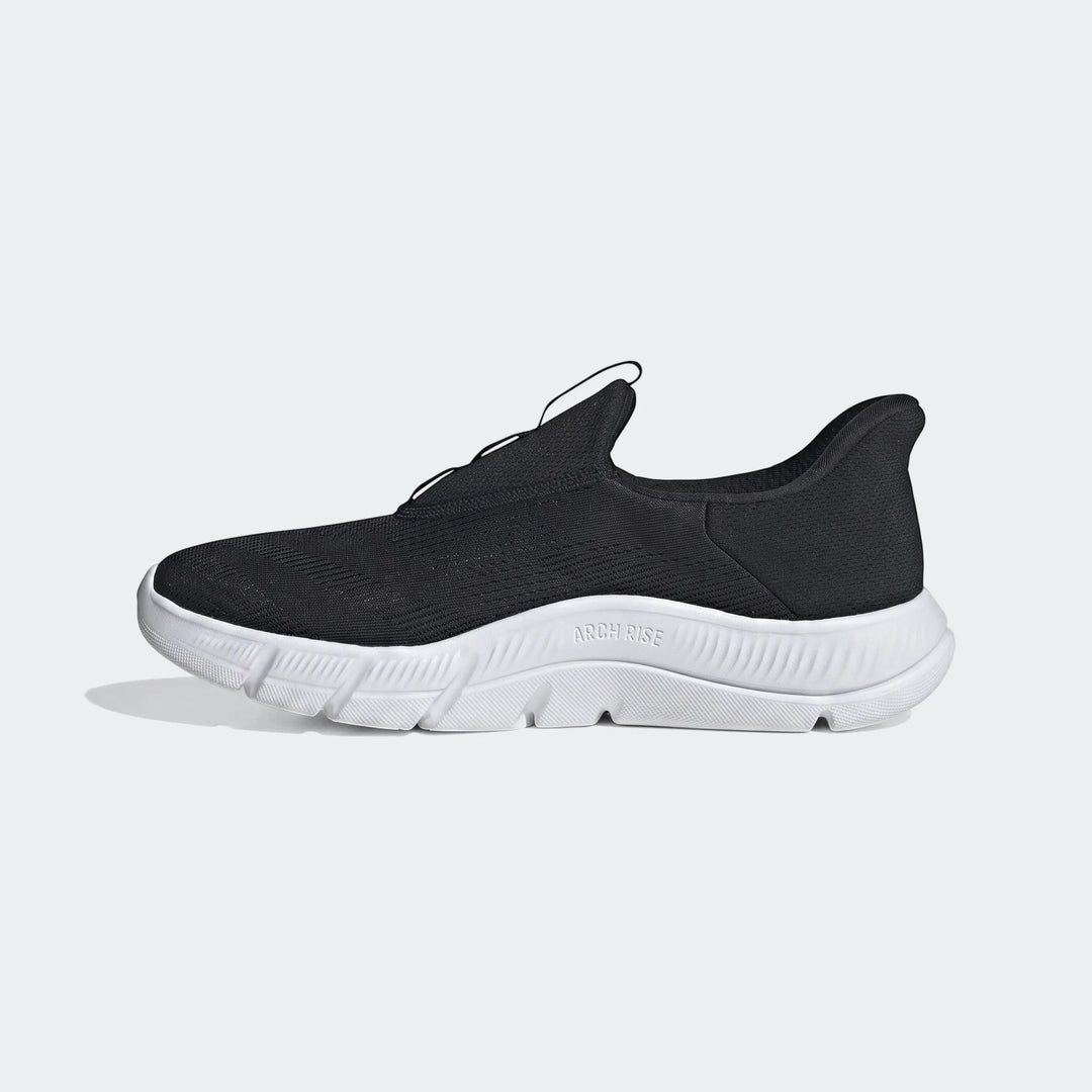 Black Cloudfoam Flex Lounge Rapidaflow shoes with white sole, side view. Mesh upper and "ARCH RISE" text on sole.