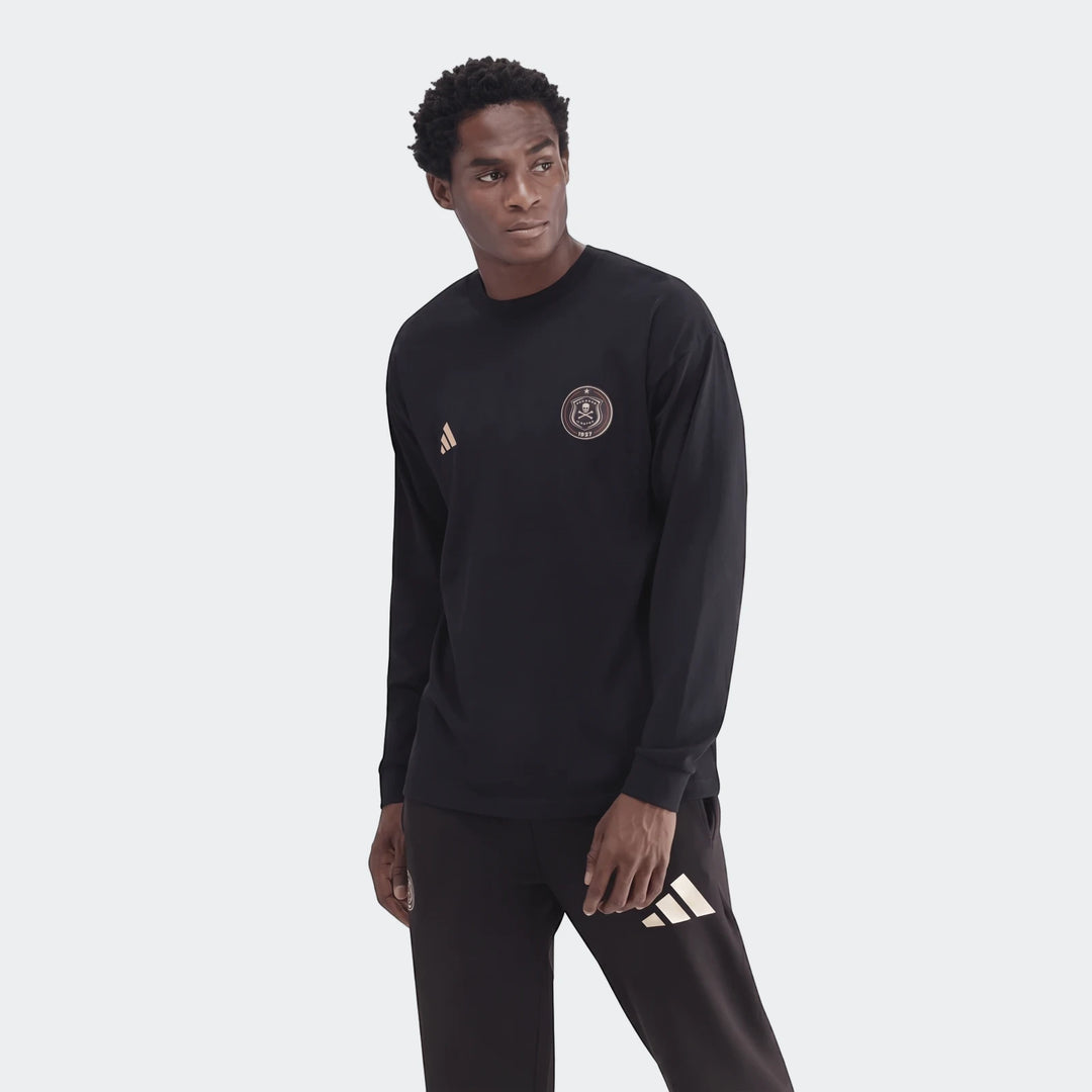 A man models a black Sportswear Open Hem Essentials+ Slim Long Sleeve T-Shirt with an Adidas logo and team crest.