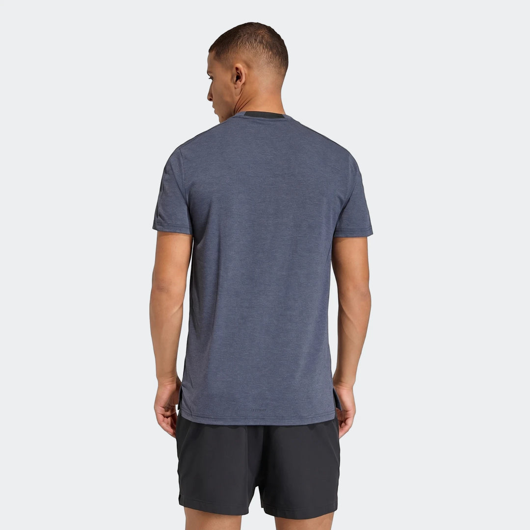 Blue D4T T-shirt on a male model from behind, paired with black athletic shorts, showcasing the shirt's fit.