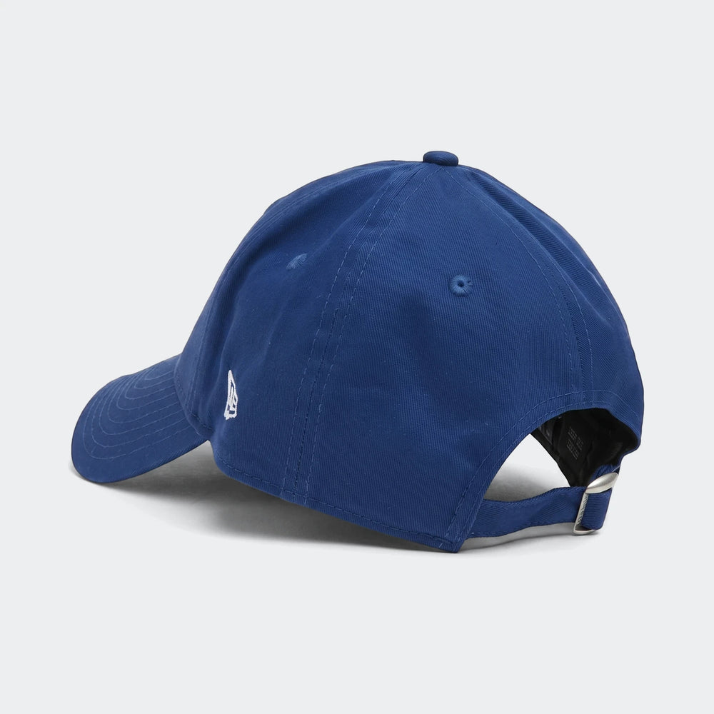 Blue New Era 940 Todd League Ess baseball cap, shown from a back-left angle, featuring an adjustable strap and white logo.
