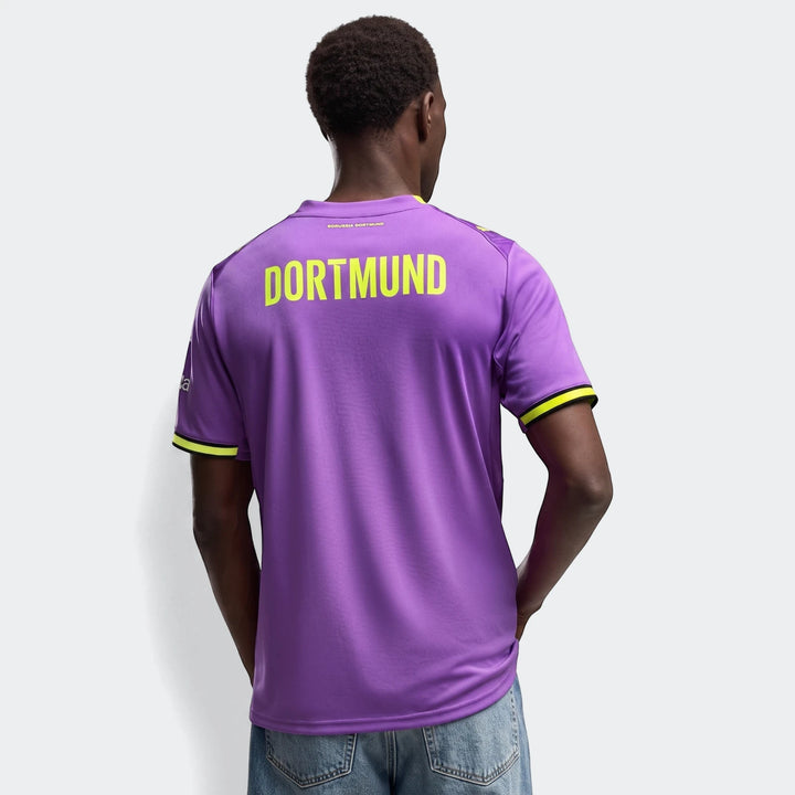 Purple Borussia Dortmund 26/27 Third Jersey for men, featuring yellow 'DORTMUND' text on the back, worn by a model in a back