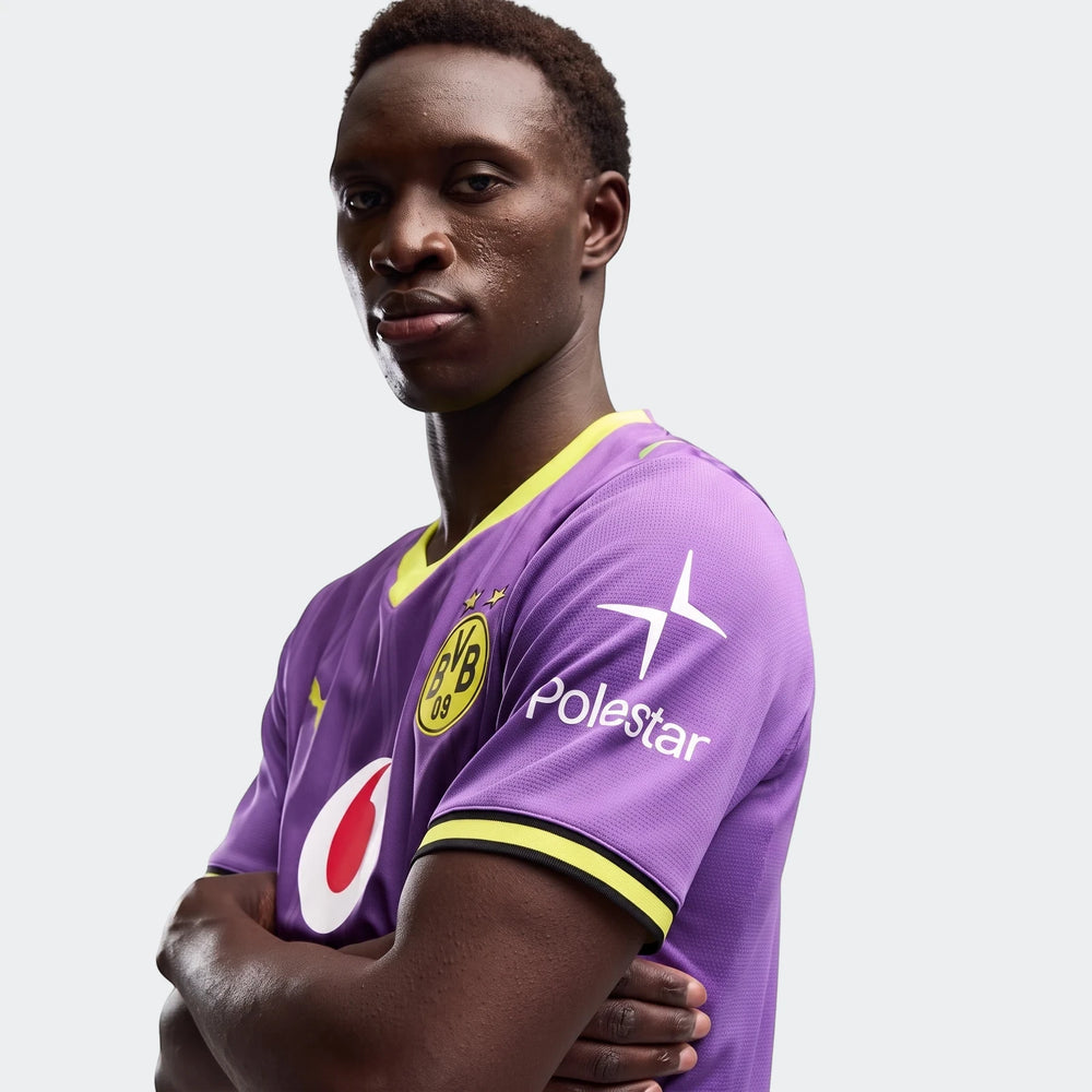 Borussia Dortmund 26/27 Third Jersey for men, presented in purple with yellow accents on a model in a studio.