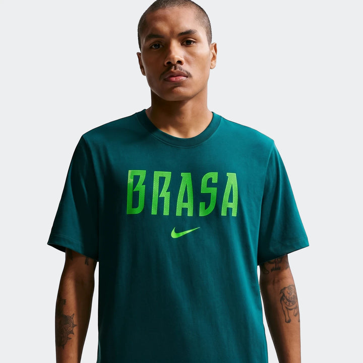 Men's Brazil Green Nike Soccer T-shirt on a model, featuring 'BRASA' text and Nike swoosh on the chest.