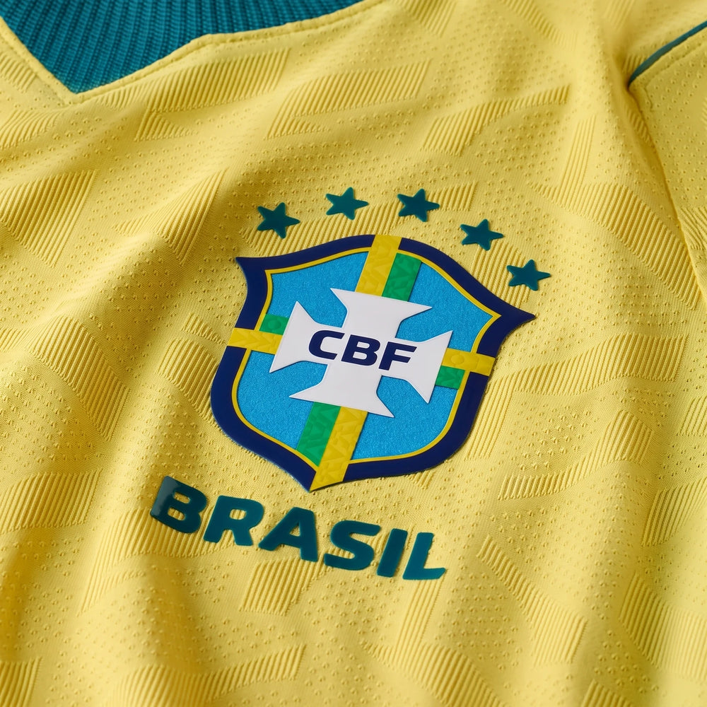 Close-up of a yellow Brazil National Team 2026 Match Home Men's Nike Aero-Fit Soccer Jersey with team crest.
