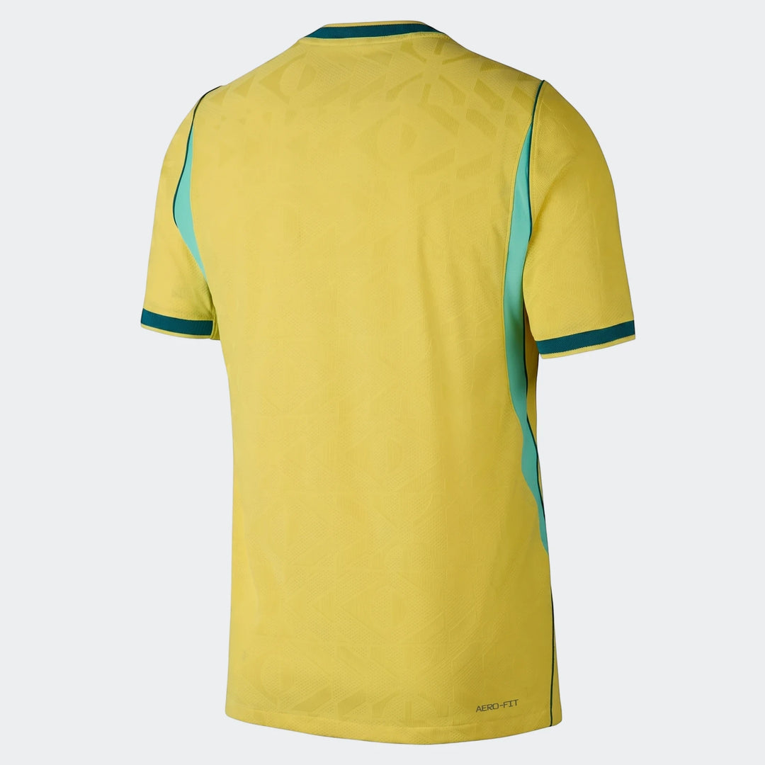Back view of a Brazil National Team 2026 Match Home Men's Nike Aero-Fit soccer jersey in yellow with teal and navy accents.
