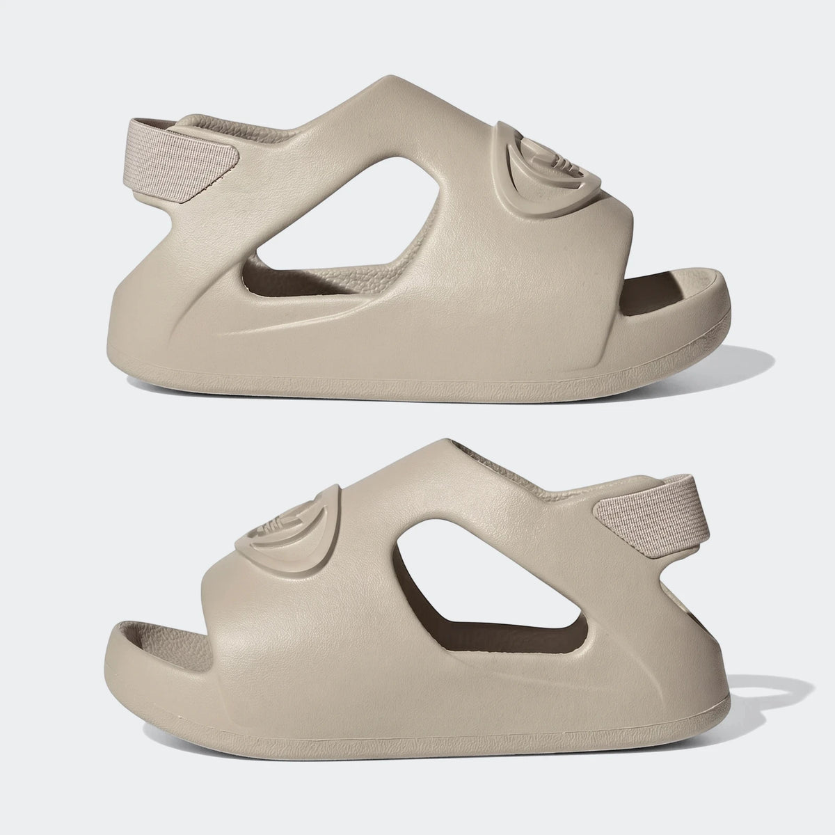 Two light beige adidas Campus 00S Foam Slides, molded design, presented side-by-side from a profile view.