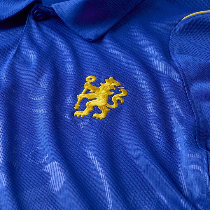 Close-up of a men's blue Chelsea FC 2026/27 Stadium Home Nike Dri-Fit soccer replica jersey featuring the yellow lion logo.