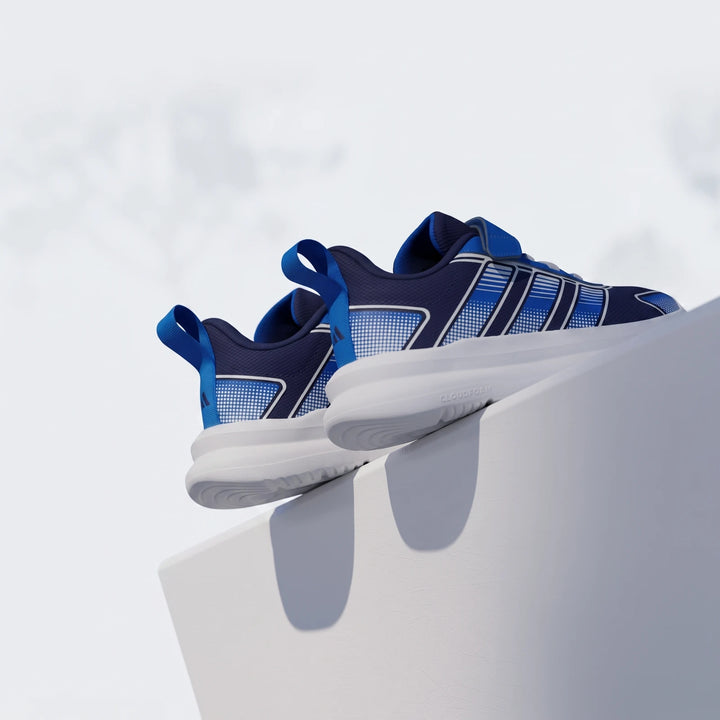 Two children's Adidas Tensaur Run 4.0 shoes in blue and navy with white soles, displayed from a low angle.