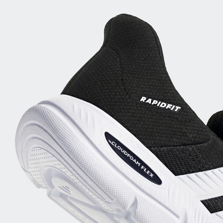 Close-up of the heel and midfoot of a black and white Cloudfoam Flex Lounge Rapidaflow athletic shoe, showcasing the