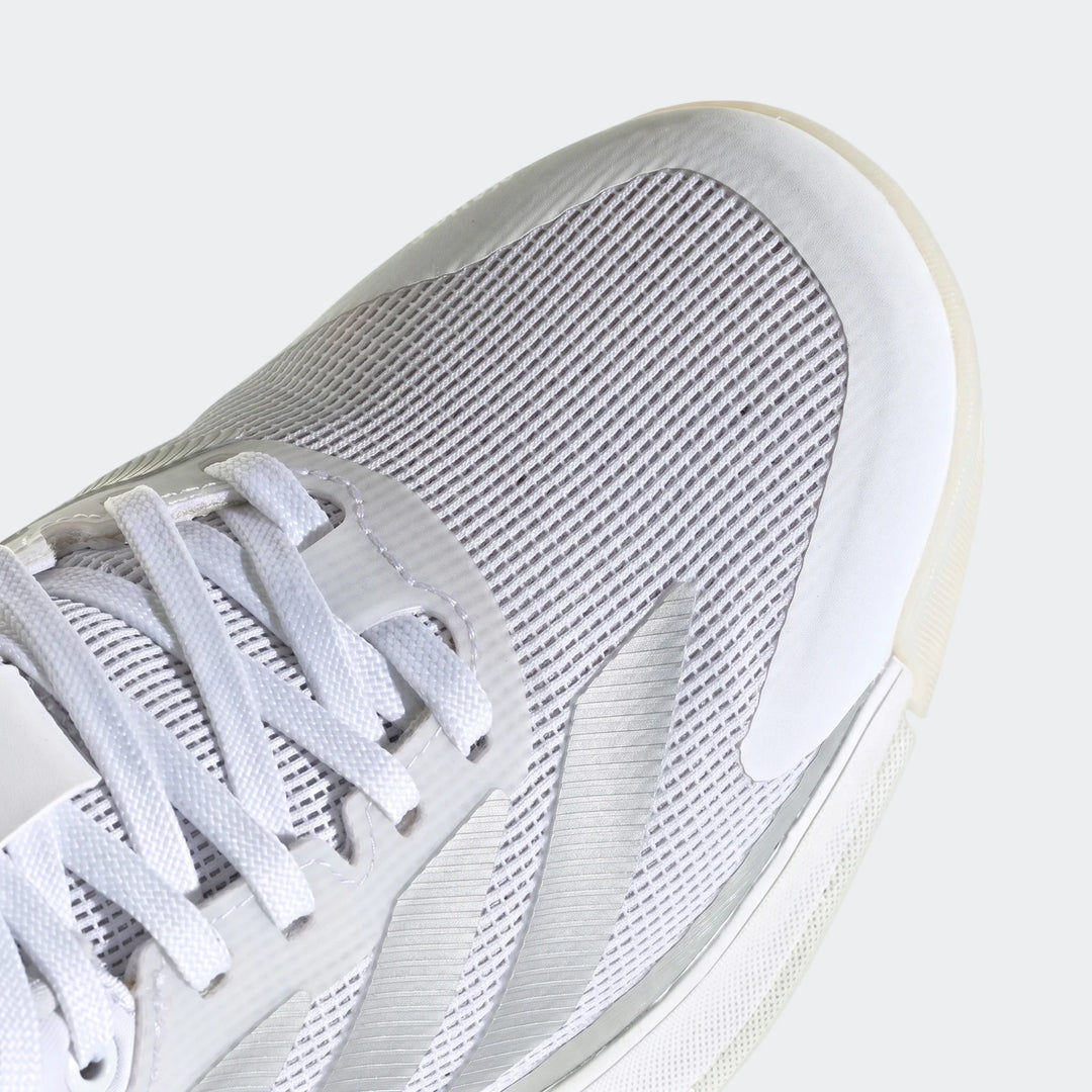 Close-up of a white Crazyquick Boost Padel shoe, featuring a breathable mesh upper and white laces.
