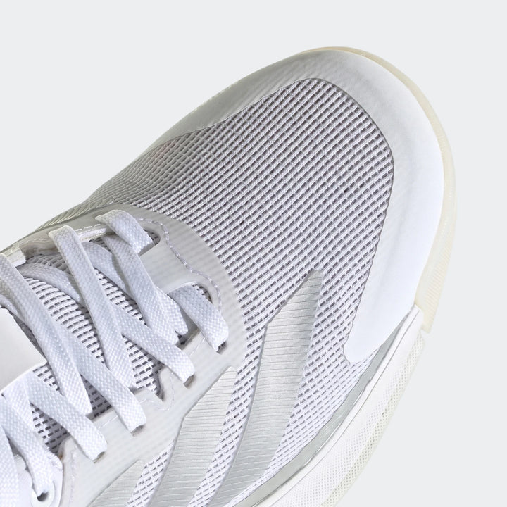 Close-up of a white Crazyquick Boost Padel shoe, featuring a breathable mesh upper and white laces.