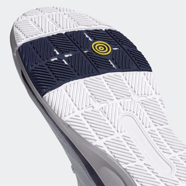 Close-up of Crazyquick Padel Shoes sole, highlighting white and dark blue traction with a central yellow concentric circle