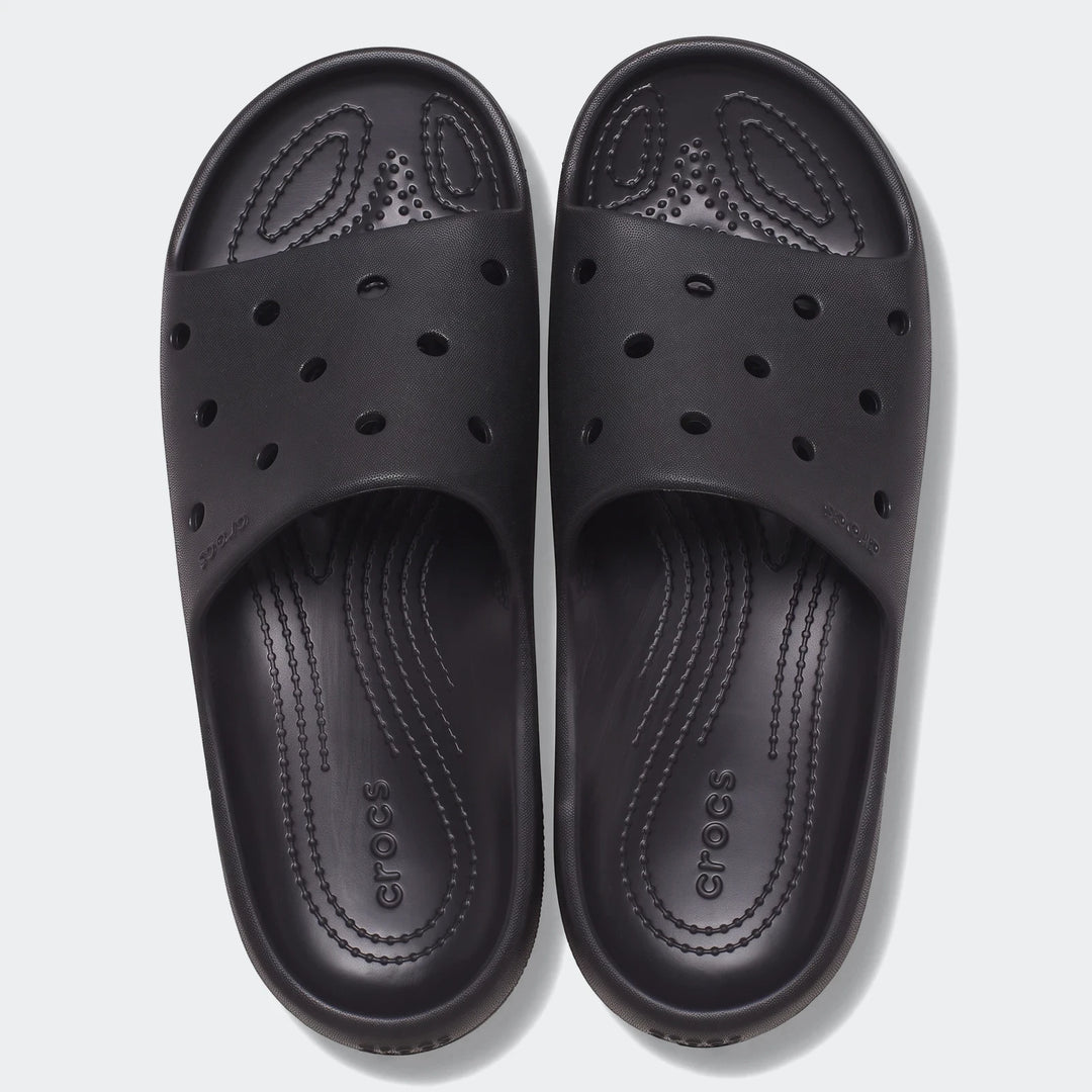 Top-down view of black Crocs Classic Slide V2 slides, featuring comfortable textured footbeds and ventilation ports, ideal