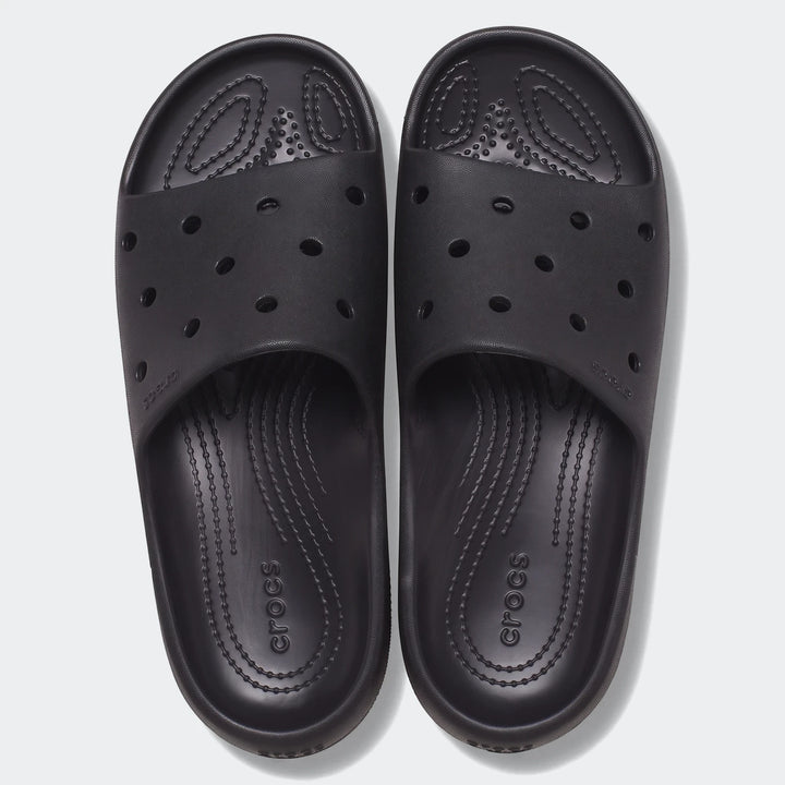Top-down view of black Crocs Classic Slide V2 slides, featuring comfortable textured footbeds and ventilation ports, ideal