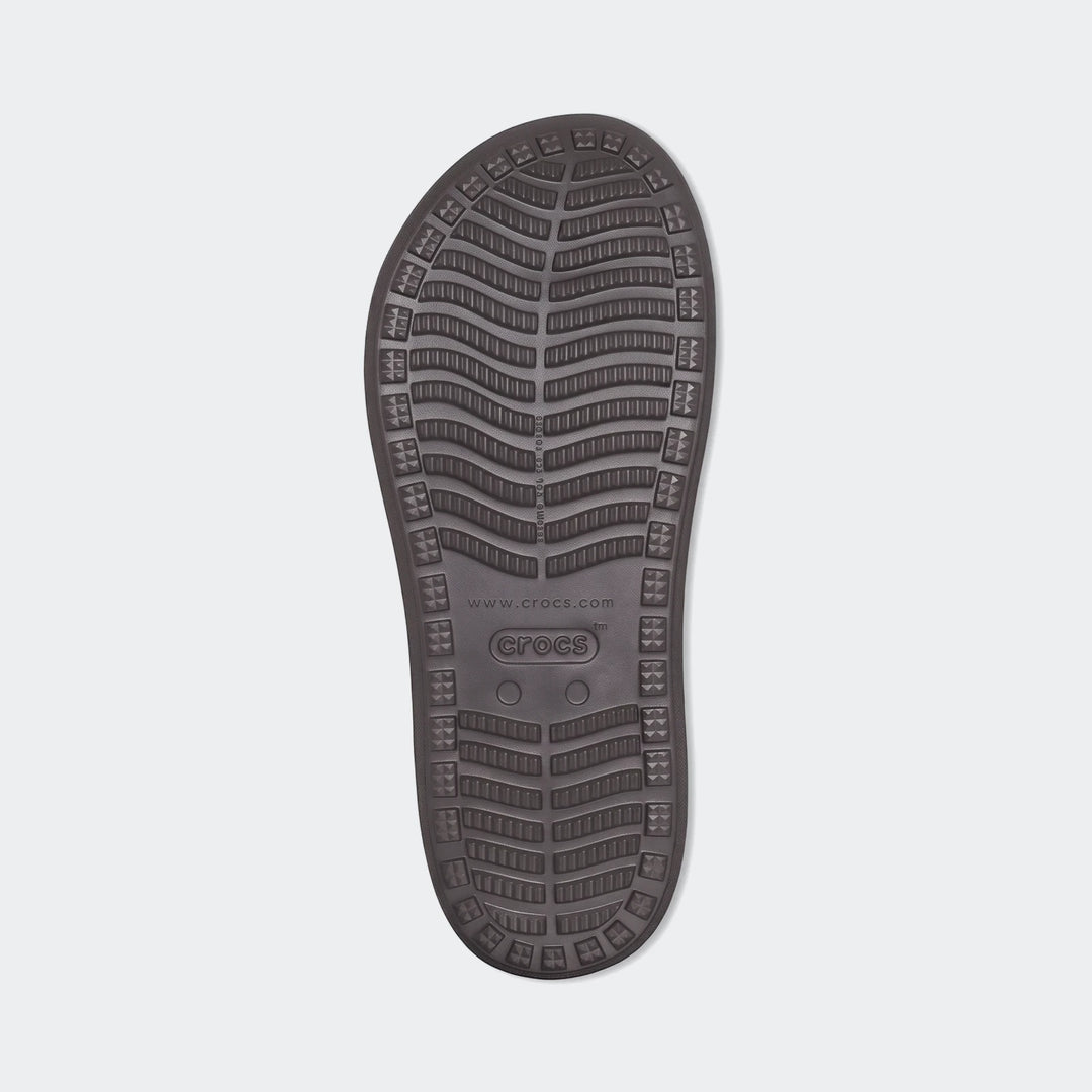 Brown Crocs Yukon Vista II Literide flip-flop sole, showcasing the textured anti-slip pattern and branding.