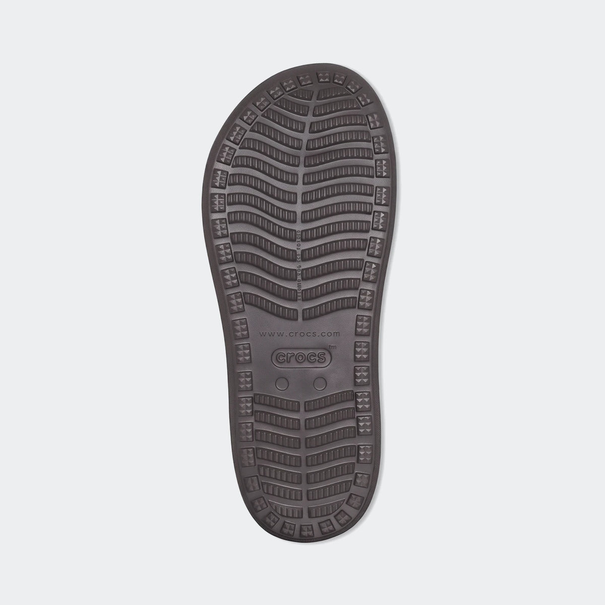 Brown Crocs Yukon Vista II Literide flip-flop sole, showcasing the textured anti-slip pattern and branding.
