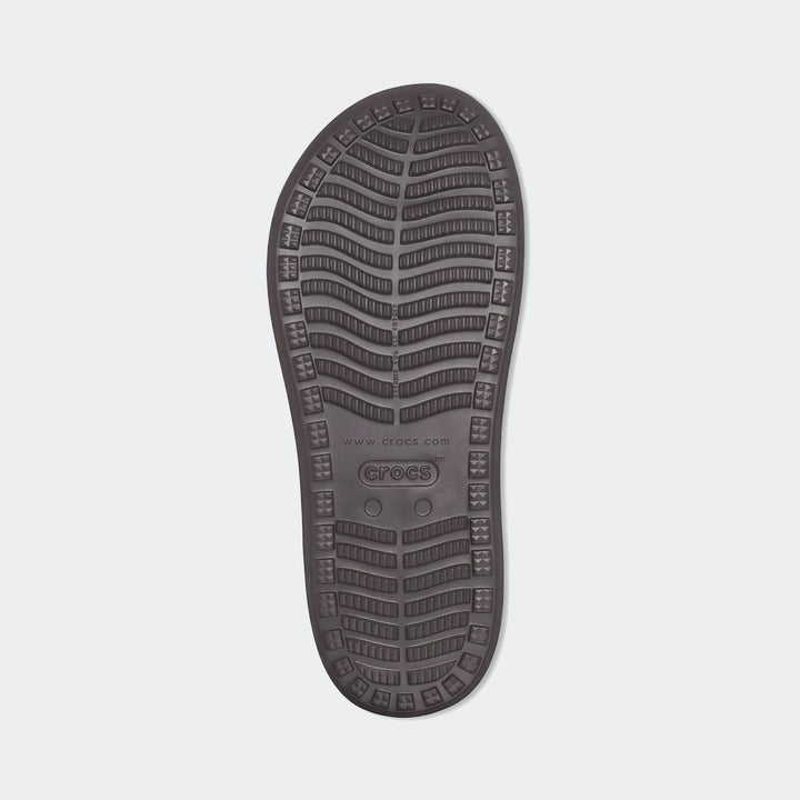Brown Crocs Yukon Vista II Literide flip-flop sole, showcasing the textured anti-slip pattern and branding.