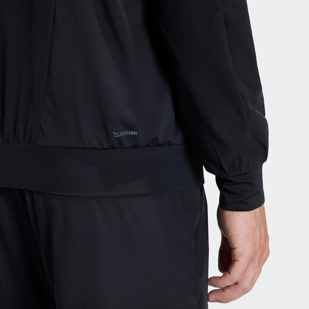 D4T Hybrid Full-Zip Hoodie in black, worn by a model, showing the lower torso and right arm with CLIMACOOL logo.