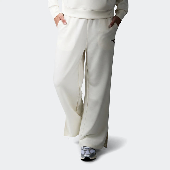 Cream Diadora Danielle Trackpant for women, shown on a model from the waist down, featuring a wide-leg design and an