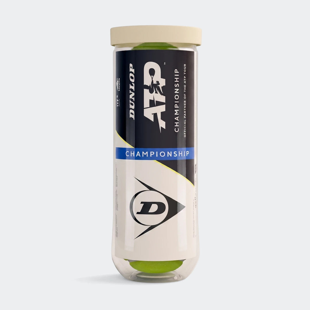 Dunlop ATP Championship tennis balls in a transparent tube with green balls, black and white branding, and a beige cap.