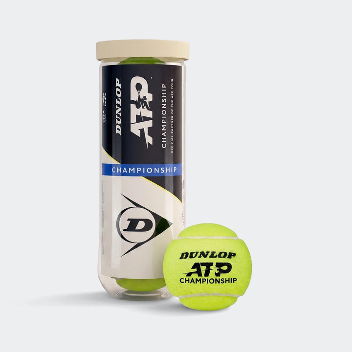 Dunlop ATP Championship tennis ball tube with three yellow tennis balls inside, and one yellow tennis ball in front.