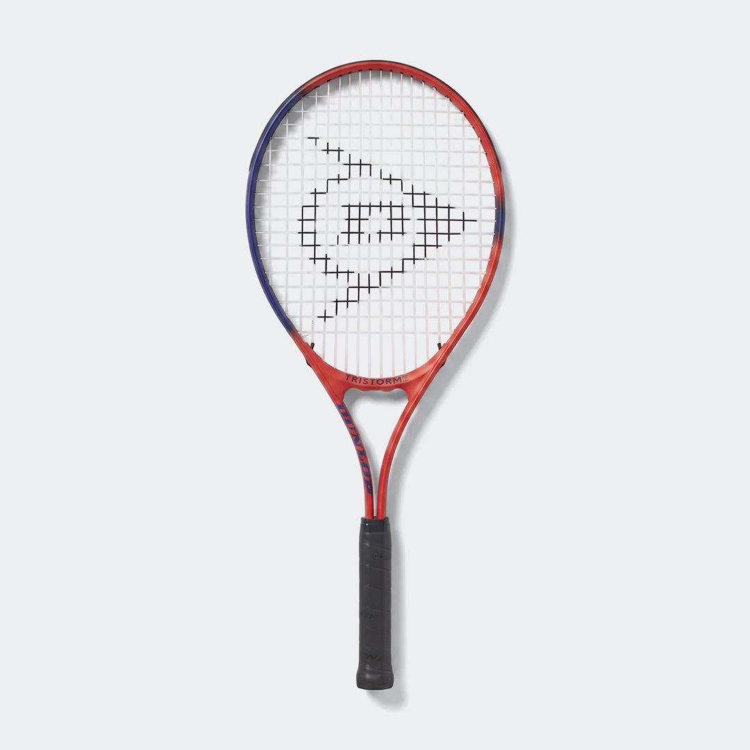 Dunlop Tristorm Jr G0 Nh Red Tennis Racket. This red and blue junior tennis racket with a black grip is shown standing