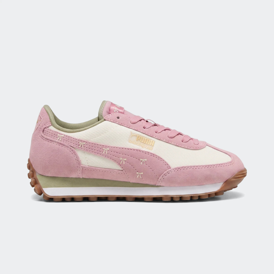 Easy Rider Bowtique Ps Pink Sneakers, featuring pink suede and off-white mesh, shown in a side view.