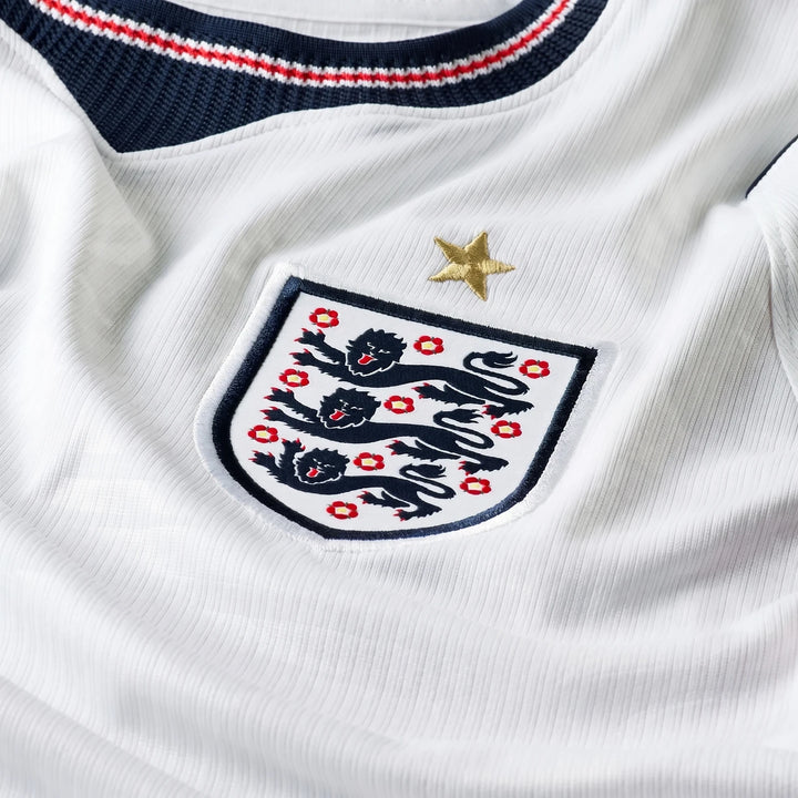 Close-up of the England National Team 2026 Stadium Home White Men's Nike Dri-Fit Soccer Jersey, showing the team crest and