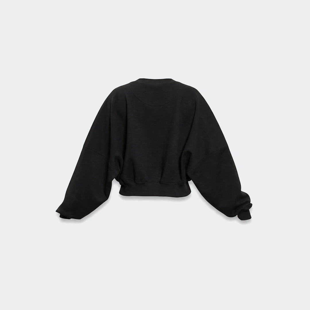 Black Essentials Fleece Crew Sweatshirt for women, featuring an oversized fit, wide raglan sleeves, and a ribbed hem, shown
