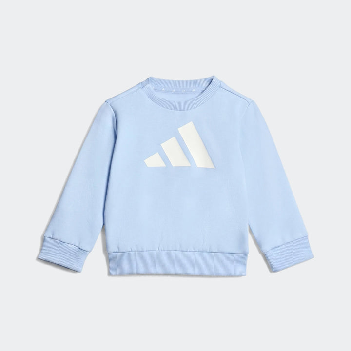 Light blue Essentials Joggers Kids with a prominent white Adidas logo on the chest, featuring a crewneck and ribbed cuffs,