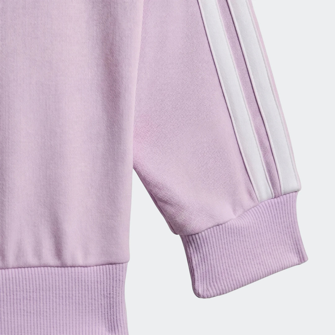 Close-up of a kid's lavender sweatshirt from the Essentials Joggers Set, featuring white stripes on the sleeve and ribbed