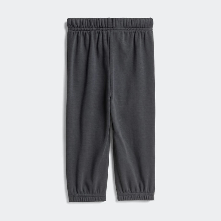 Dark grey Essentials Kids' Joggers in a comfortable fleece material, arranged flat on a white background, featuring