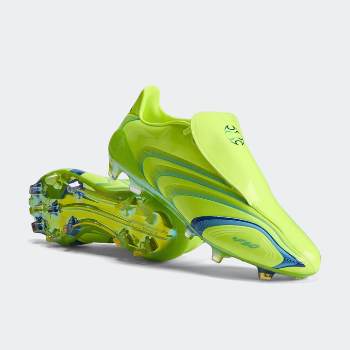 F50 Elite Fg Tunit Football Boots in neon yellow with blue accents and iridescent soles, captured in a studio shot.