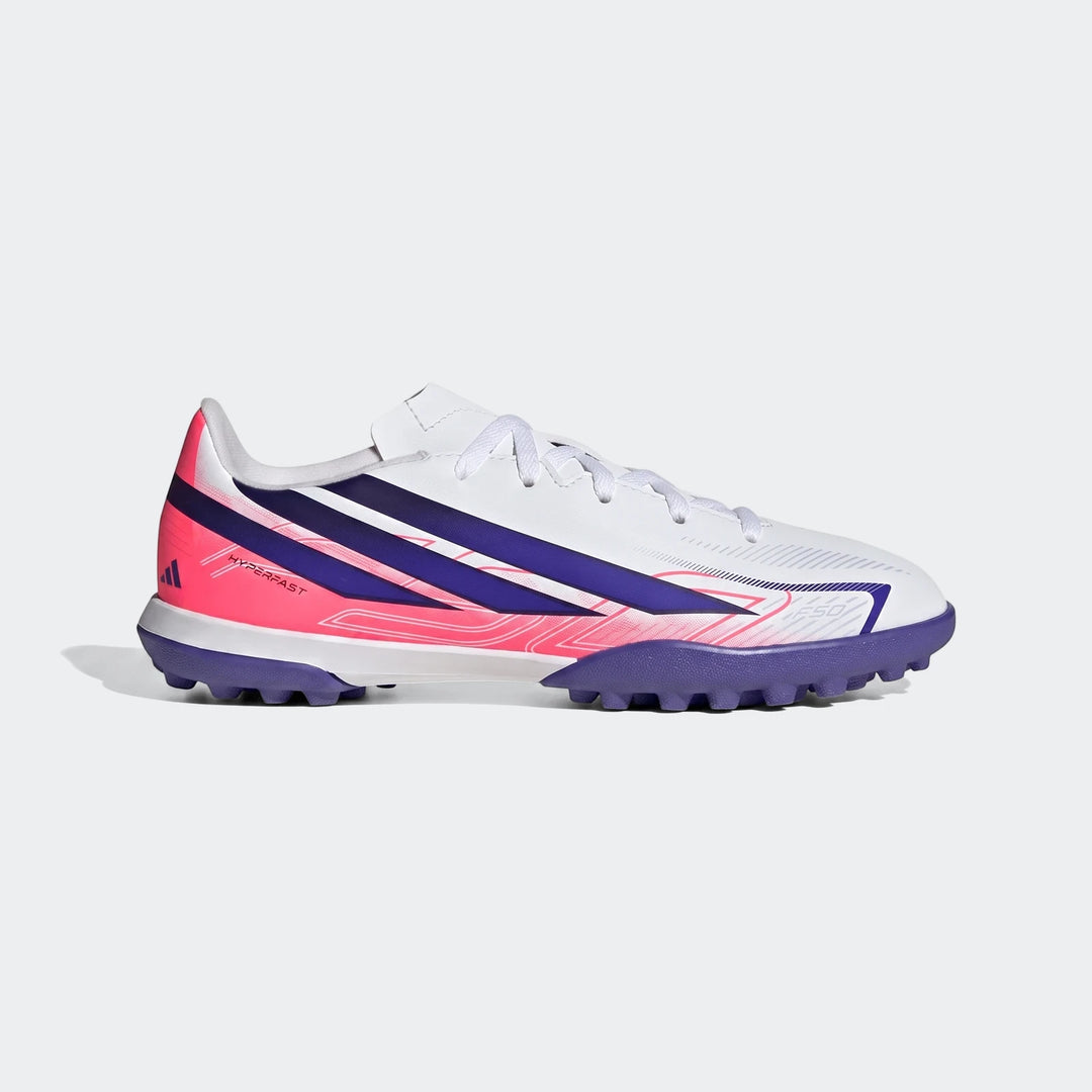 Kids' F50 Hyperfast Club Turf Football Boots in white, purple, and pink, shown in a side view.