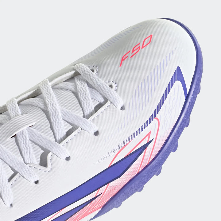 Close-up of a white, red, and purple Kids F50 Hyperfast Club Turf Football Boot, featuring intricate laces and sole details.