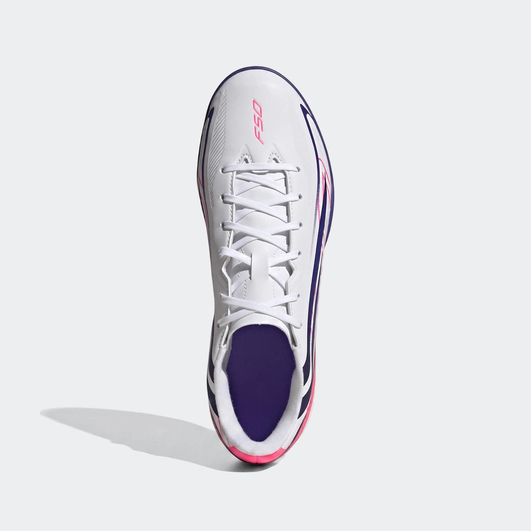 White, pink, and navy Adidas F50 Hyperfast Club Turf Football Shoes, shown from a top-down view.