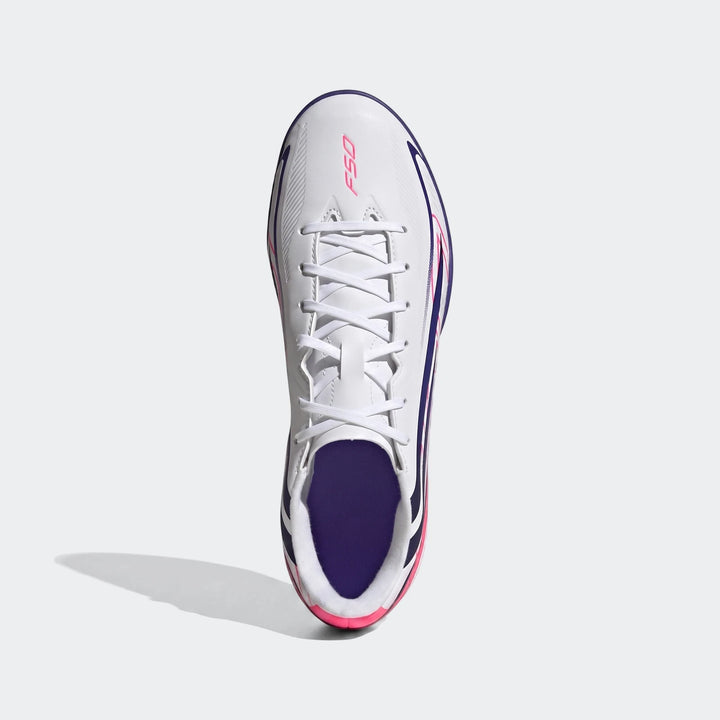 White, pink, and navy Adidas F50 Hyperfast Club Turf Football Shoes, shown from a top-down view.