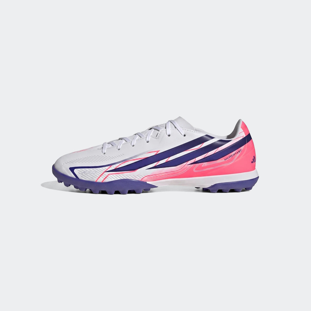 F50 Hyperfast Club Turf Football Shoes in white, pink, and purple with a studded sole, shown in a side profile view.