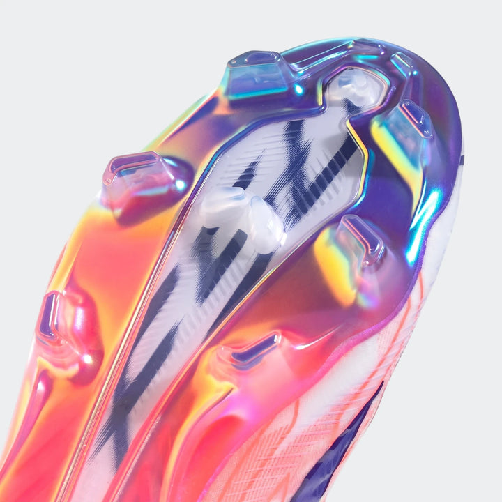 Close-up view of the iridescent sole of an F50 Hyperfast Elite Firm Ground Football Boot, featuring colorful studs and a