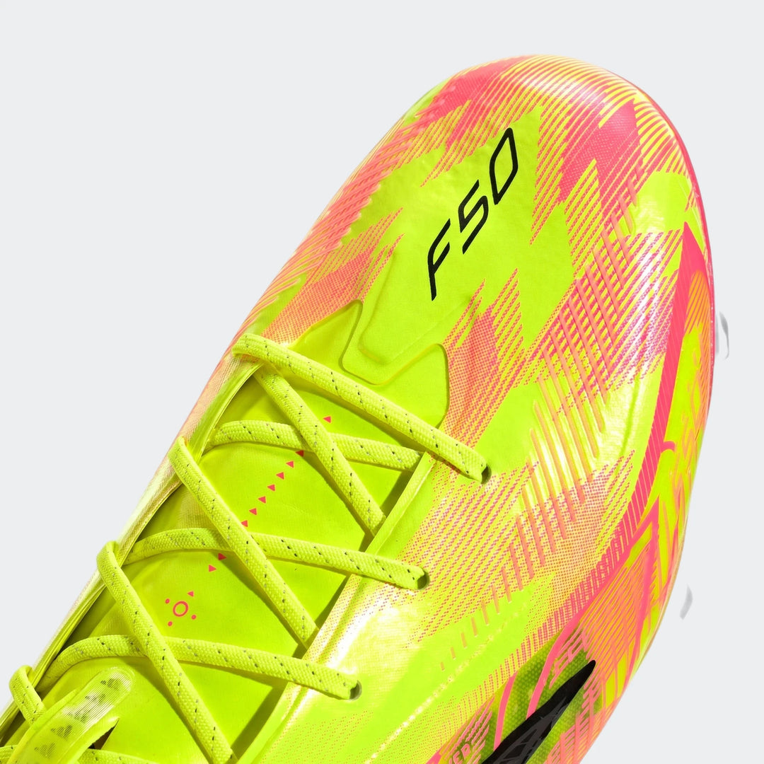 Close-up view of a neon yellow and hot pink F50 Hyperfast Elite Firm Ground Football Boot with black branding and speckled