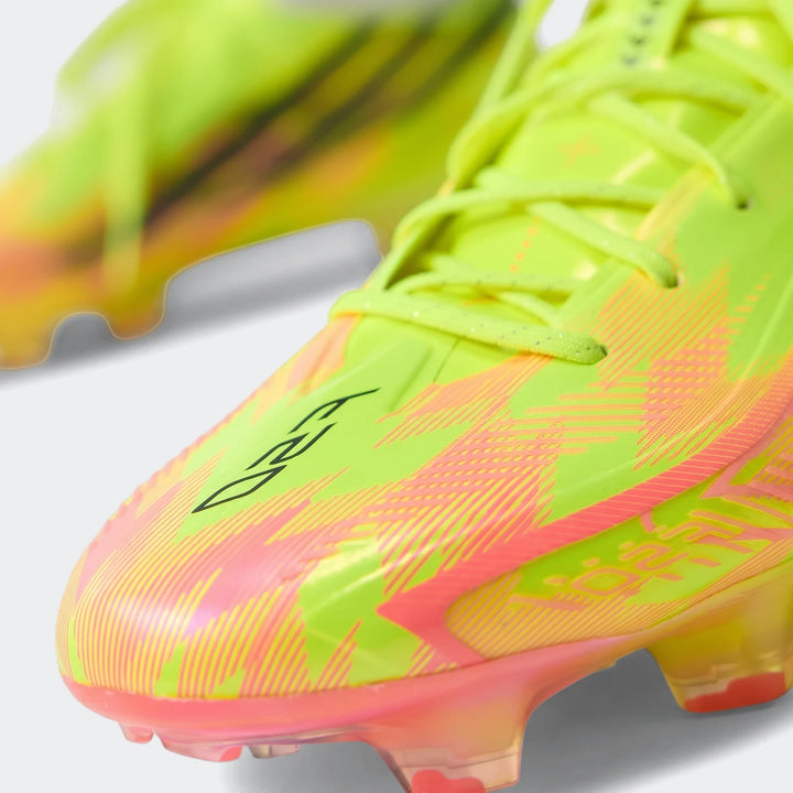 Close-up of F50 Hyperfast Elite Firm Ground Football Boots in vibrant neon yellow and pink with black F50 logo.