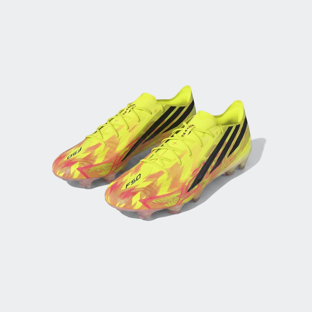 A pair of neon yellow and pink F50 Hyperfast Elite Firm Ground Football Boots, angled on a studio backdrop.