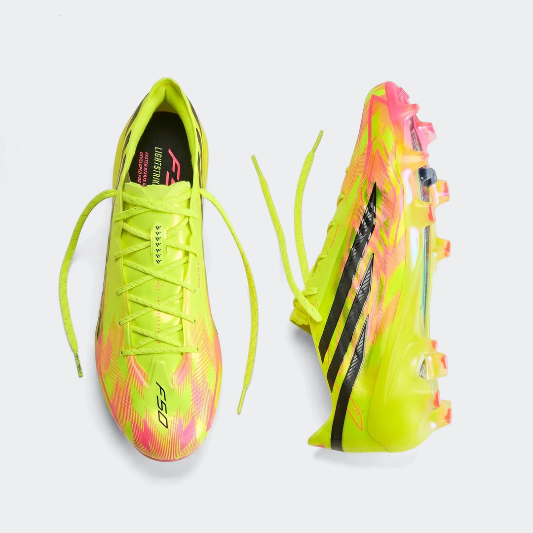 Pair of F50 Hyperfast Elite Firm Ground Football Boots in neon yellow and pink, shown from a top-down view.