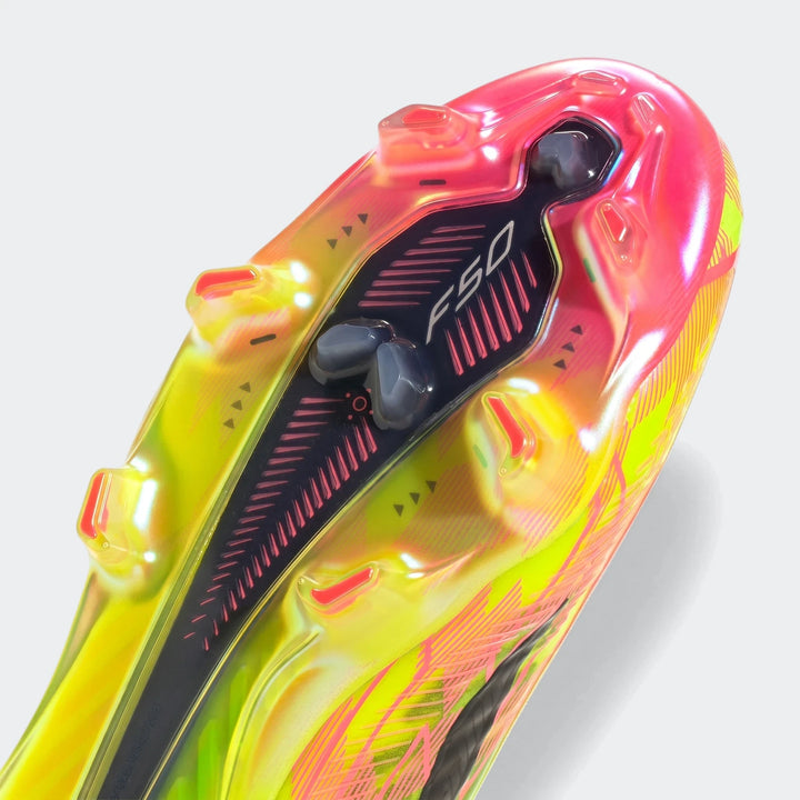 F50 Hyperfast Elite Firm Ground Football Boots in iridescent pink and yellow, showcasing the sole view with studs.