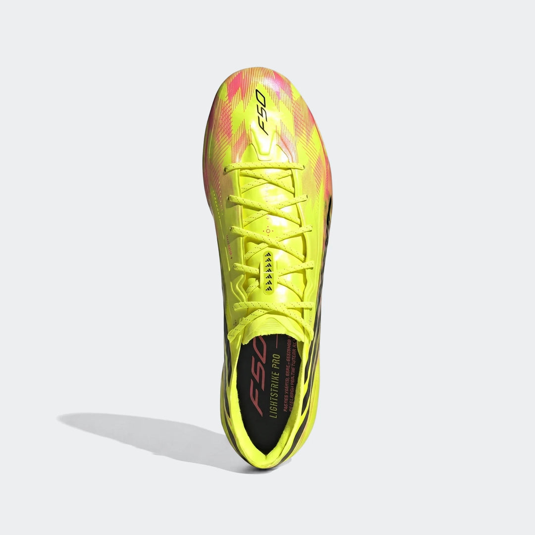 Yellow and pink F50 Hyperfast Elite Firm Ground Football Boots with black accents, shown from a top-down view.