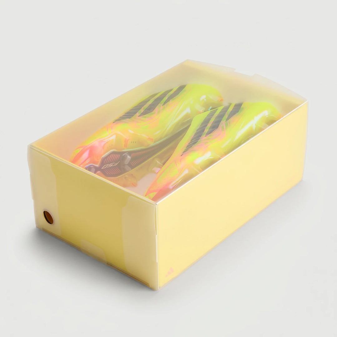F50 Hyperfast Elite Laceless Firm Ground Boots in vibrant neon yellow and pink, showcased in a clear display box.