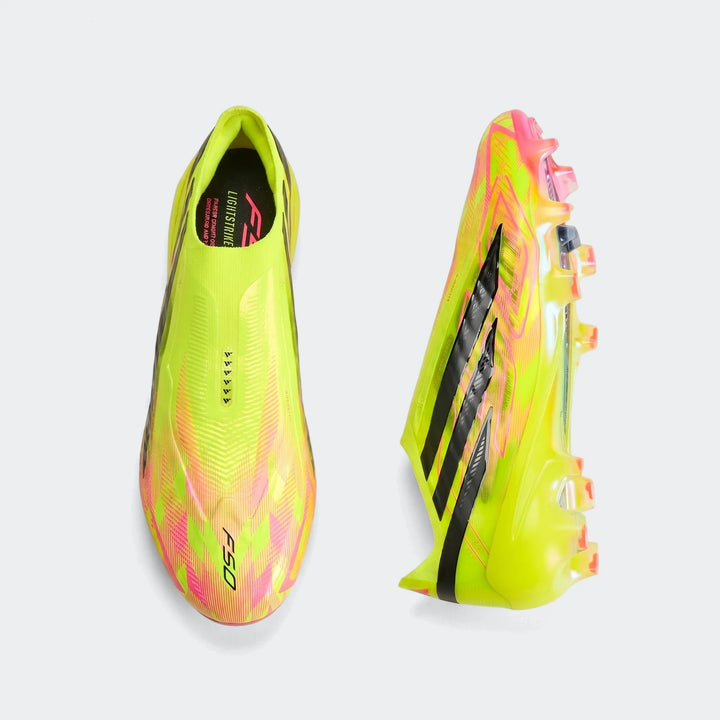 Pair of F50 Hyperfast Elite Laceless Firm Ground Boots in vibrant neon yellow and pink, viewed from top and side.